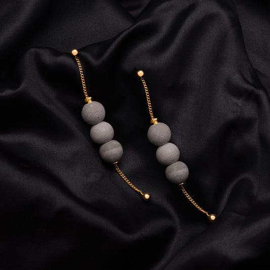 Dangling Orb Earrings – Sculptural Elegance in Motion